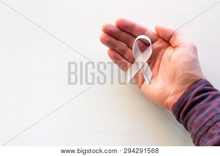 Man Hold White Ribbon With Place For Text On White Background