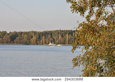 Autumn Lake, Yellowed Lake Against A Lake With A Yacht