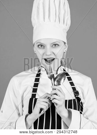 Im A Great Cook. Sensual Lady Cook. Pretty Cook Holding Stainless Steel Spoon And Fork. Professional