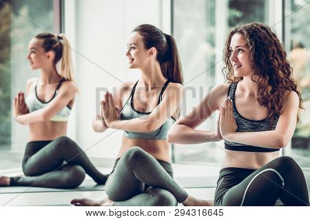 Yoga Girls On Fitness Class Background Practicing Nadi Shodhana Pranayama Or Breathingin In Gomukhas