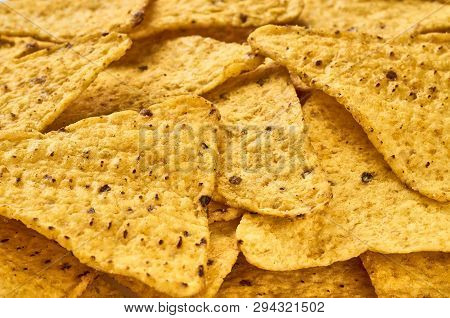 Background Yellow Triangular Corn Nachos With Seasonings
