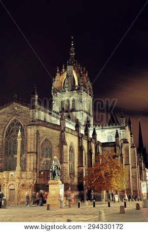 EDINBURGH, UK - OCT 8: St Giles' Cathedral and street view on October 8, 2013 in Edinburgh. As the capital city of Scotland, it is the largest financial centre after London in the UK.