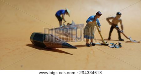 2 Man And 1 Woman Cleaning Trash From Pencil Sharpener With Negative Space