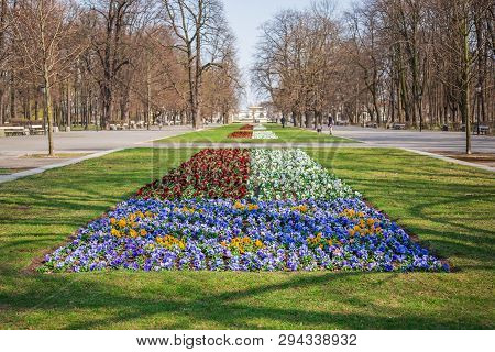 Warsaw, Poland - April 3, 2019: Beautiful Saxon Garden, Park With Red, Blue And White Flowers.