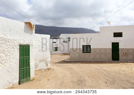 Empty Street With Sand And White Houses In Caleta De Sebo On The Island La Graciosa Of Lanzarote
