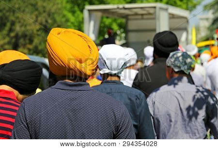 Many Sikh Men During A Religious Celebration On The Road