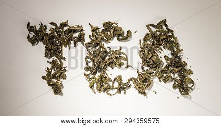 Inscription Tea From Green Tea Leaves On A White Background