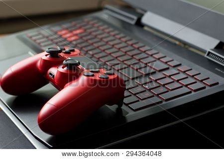 Gamepad, Laptop On A Table. Gamers Background Concept