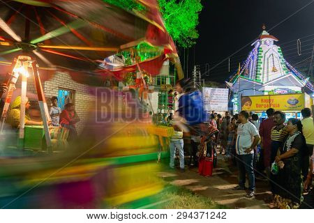 Howrah,west Bengal,india -april 15th, 2018 : Children Are Riding On Nagordola- A Traditional Amuseme