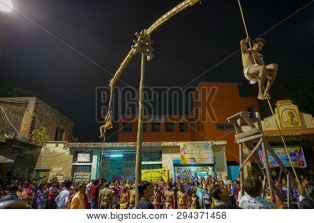 Kolkata, West Bengal, India - 15 April 2018: Two Hindu Devotees Are Hanging From Pole In Air, At Nig