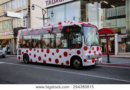 Matsumoto, Japan- March 26, 2019: City Bus With Bright Red Circles On A White Background On A Street