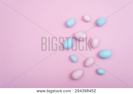 Pink And Blue Pastel Preaded Easter Eggs On Pink Background