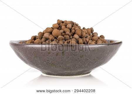 Lot Of Whole Brown Clay Pebbles (leca) On Grey Ceramic Plate Isolated On White Background