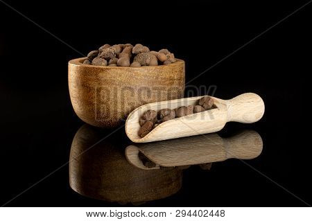 Lot Of Whole Brown Clay Pebbles (leca) With Wooden Bowl And Wooden Scoop Isolated On Black Glass