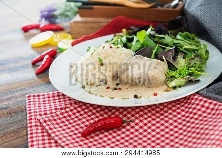 Veal Paupiette stewed with cream and rice
