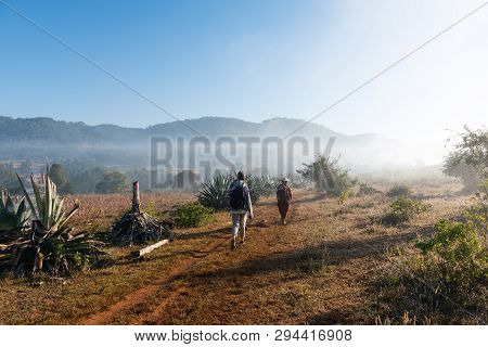 Inle Lake, Myanmar - 27 November, 2018: Wide Angle Picture Of Backpackers Tourist Treeking With Fog 