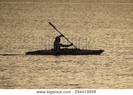Captiva Island, Florida 08-05-2015 Young Man Kayaks Off The Beach In Captiva Island In Partial Silho