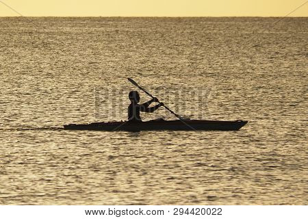 Captiva Island, Florida 08-05-2015 Young Man Kayaks Off The Beach In Captiva Island In Partial Silho