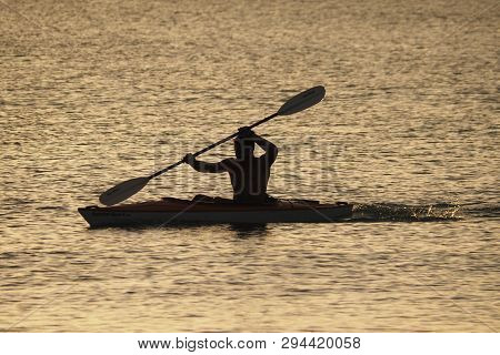 Captiva Island, Florida 08-05-2015 Young Man Kayaks Off The Beach In Captiva Island In Partial Silho