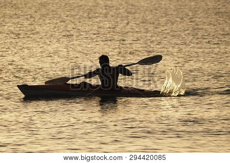 Captiva Island, Florida 08-05-2015 Young Man Kayaks Off The Beach In Captiva Island In Partial Silho