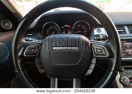Novosibirsk, Russia - 03.10.2019: View To The Interior Of Land Rover Evoque With Dashboard, Clock, M