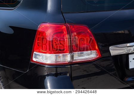 Novosibirsk, Russia - 03.10.2019: Rear Taillamp View Of Toyota Land Cruiser 200 In Black Color After