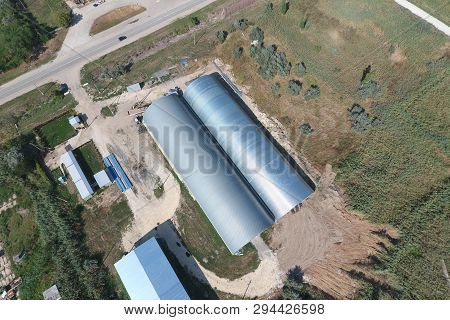 Top View Of The Hangars. Hangar Of Galvanized Metal Sheets For The Storage Of Agricultural Products 