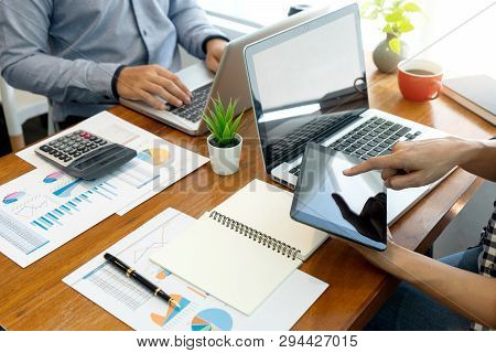 Businessman Work With Friend On The Table With Computer Laptop Calulator ,working Data Analyses For 