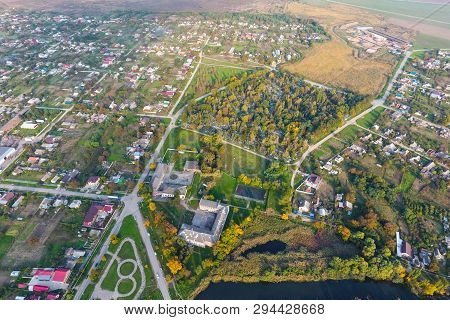 Top View Of The Village. One Can See The Roofs Of The Houses And Gardens. Road And Water In The Vill