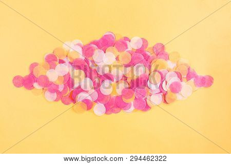 Orange, Pink And White Confetti On Orange Background. Flat Lay Style. Top View. Copyspace For Text.