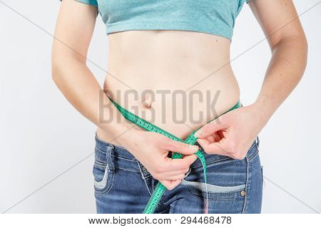 Woman Body After Weight Loss. Cropped Close Up Photo Of Fatless Slender Body Parts And Proportions W
