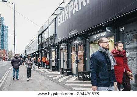 London, Uk - April 6, 2019: People Walking Past The Shops At Boxpark Shoreditch, London, Shipping Co