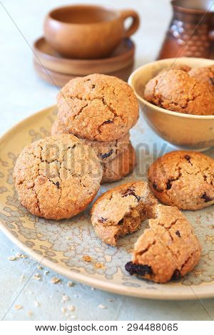 Nice And Healthy Dessert. Homemade Oatmeal Cookies With Dried Cranberries And Coffee In Cerve