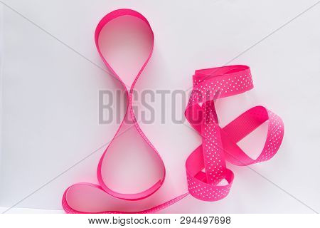 8 March - International Woman`s Day Concept. Pink Matte Ribbon Cloth Tape On The White Background.