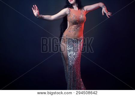 Girl With A Smart Figure Poses In A Beautiful Beige Dress For Belly Dance, Fusion, Tribal. A Woman I
