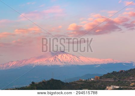 Smoking Snow-capped Mount Etna Volcano At Sunrise, As Seen From Taormina, Sicily