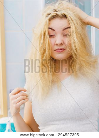 Young Blonde Female Feeling Dull And Tired After Waking Up. Woman Yawning Being Sleepy In Bathroom.