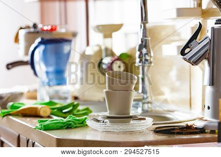 Coffee Gringer And Two Empty Dirty Cups After Cappuccino Drinking In Home Kitchen. Messy Interior.