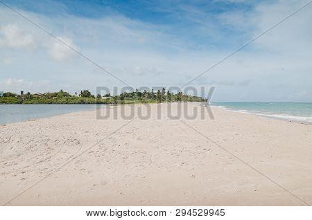 Beach And Lagoon. Lagoon Called Maceio In Front Of The Sea Separated By A Sand Bank At Tabatinga Bea
