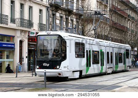 Grenoble, France - March 14, 2019: Articulated Urban Tramway Alstom Tfs2 In The City Street.