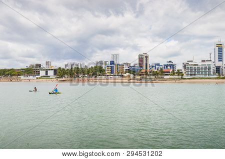 Joao Pessoa - Pb, Brazil - February 21, 2019: Tourists Riding Kayak And The Praia Do Bessa Beach And
