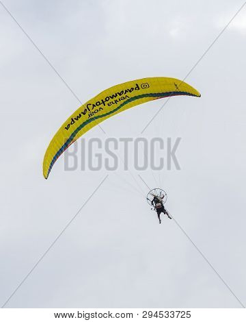 Joao Pessoa - Pb, Brazil - February 23, 2019: Flying On A Motor Paragliding. Tourist Being Guided On