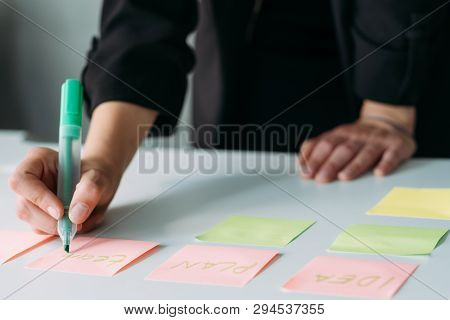 Business Strategy Design. Corporate Brainstorming And Brainwork. Woman Using Sticky Labels To Take N