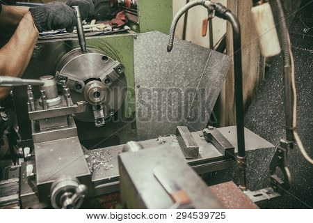 The Skill Operator Working With Lathe Machine In Vintage Scene.the Lathe Machine Cutting The Metal S