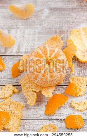 Peele Dripe Tangerines On Wooden Light Background