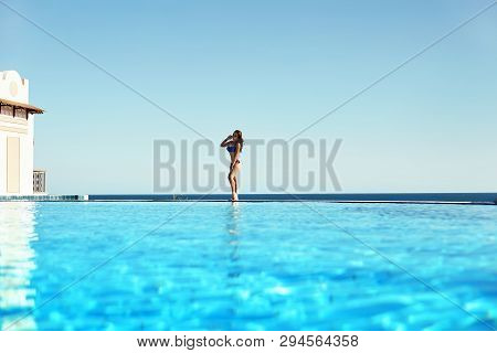 Young Woman Feel Freedom And Enjoying Relaxationin Infinity Pool , Travel And Leisure, Vacation Retr