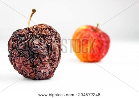 Wrinkled Apple Texture With White Background. Shriveled Apple. Old Apple. Isolated On White.