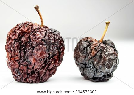 Wrinkled Apple Texture With White Background. Shriveled Apple. Old Apple. Isolated On White.