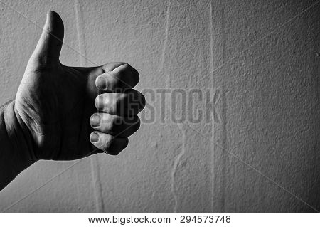 Black And White Image Of A Hand Giving A Thumbs Up