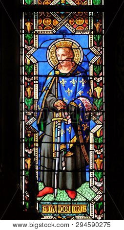 FLORENCE, ITALY - JANUARY 10, 2019: Saint Ludovicus, stained glass window in the Basilica di Santa Croce (Basilica of the Holy Cross) - famous Franciscan church in Florence, Italy